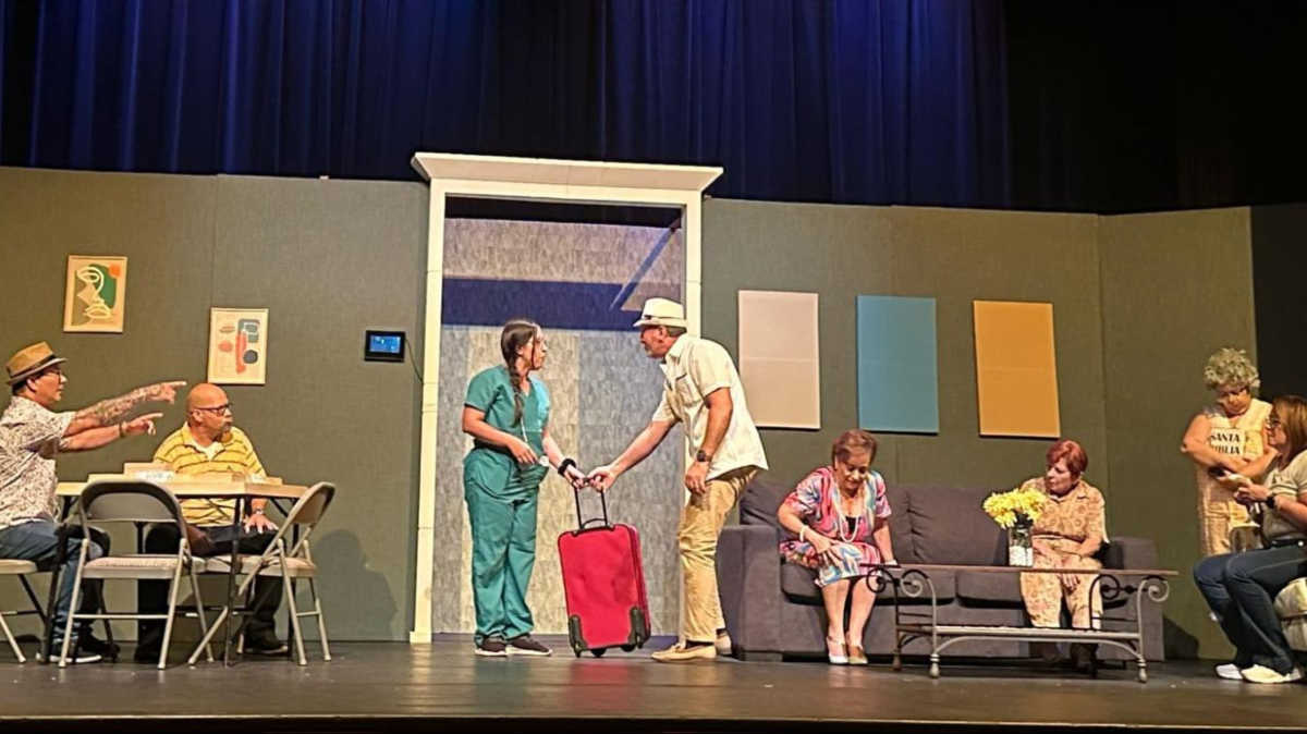 The author Vanessa Ramos participating in a play with her co-actors in Teatro Luis M. Arcelay