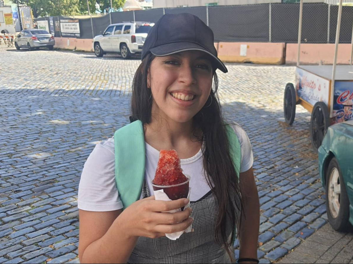 The author Vanessa Ramos eating piraguas