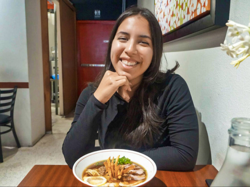 The author Vanessa Ramos with a bowl of tonkotsu in Peko Peko
