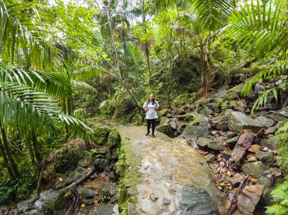 The author Vanessa Ramos hiking on a rainy day at El Yunque
