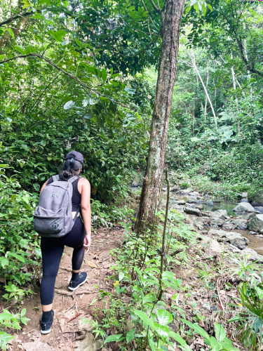 The author Vanessa Ramos, hiking at the lush trail of Charco Prieto