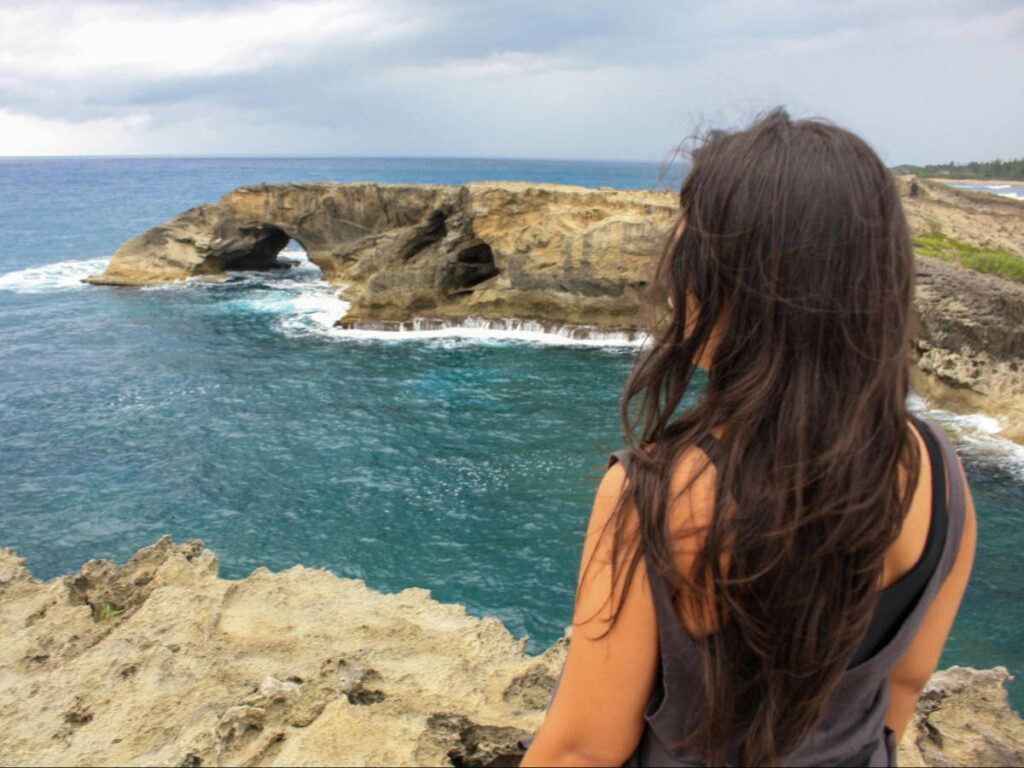 The author Vanessa Ramos overlooking the Cueva del Indio in Arecibo