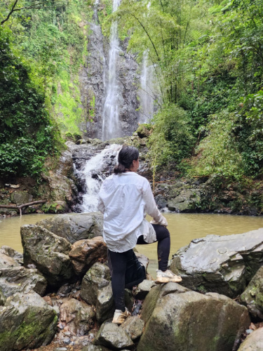 The author Vanessa Ramos standing on the big stones in Charco Prieto