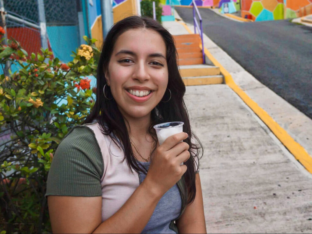 The author Vanessa Ramos, drinking limber on a cup in Yauco