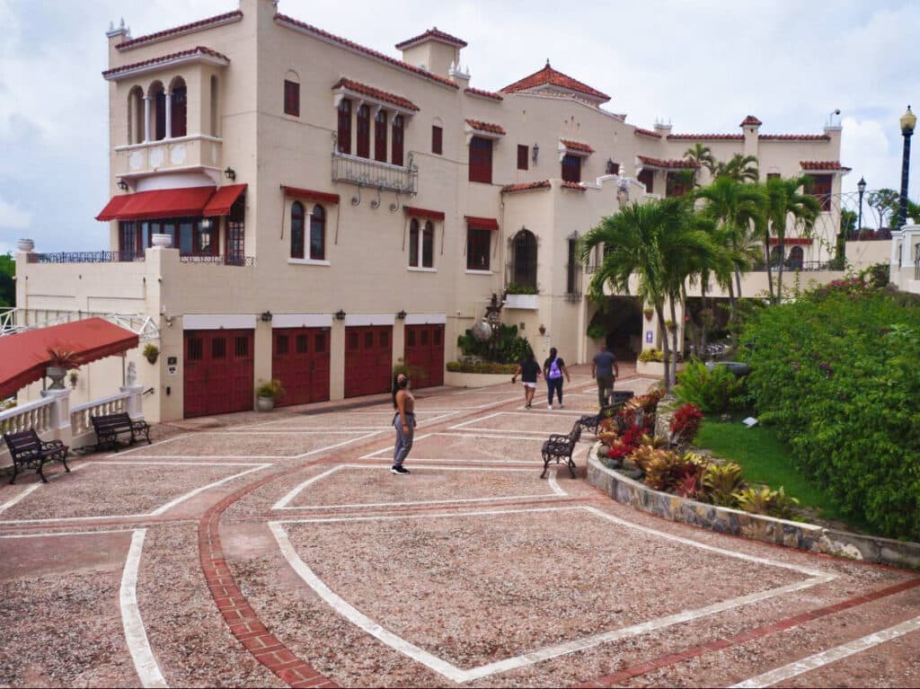 The author Vanessa Ramos, posing near the entrance to the Castillo Serrallés