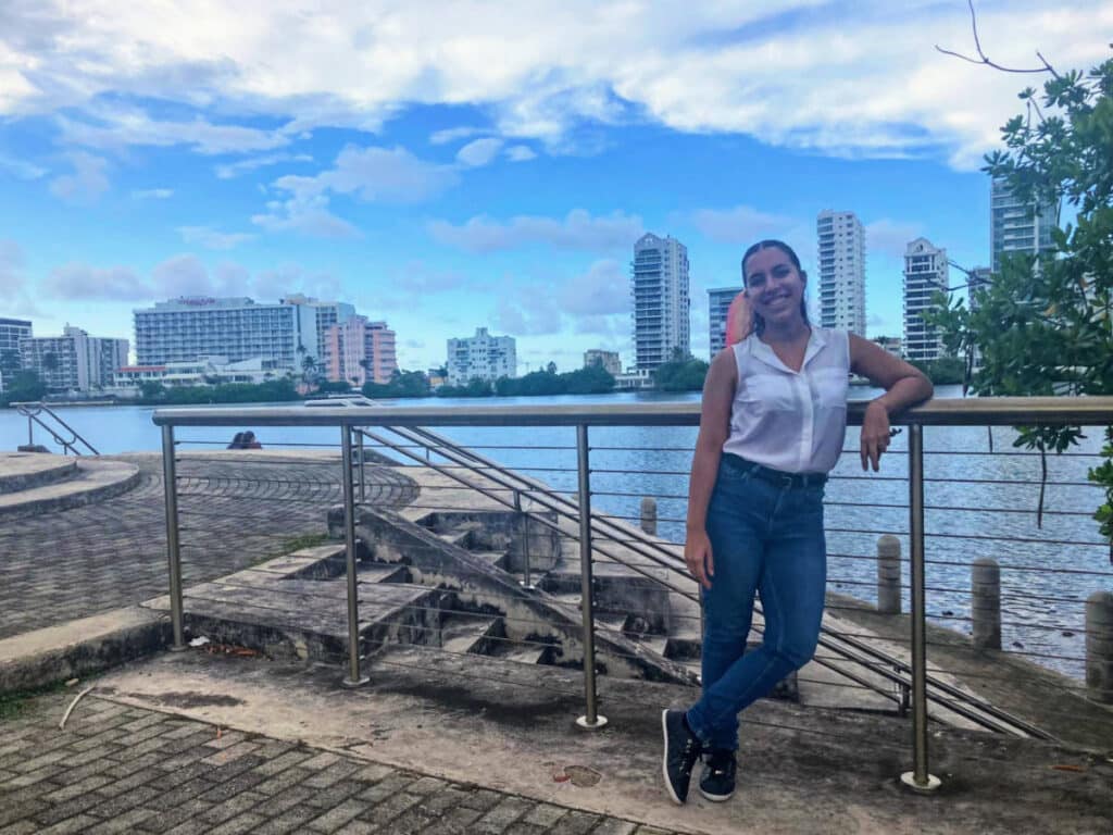 The author, Vanessa Ramos posing for a photo in front of the Condado Lagoon
