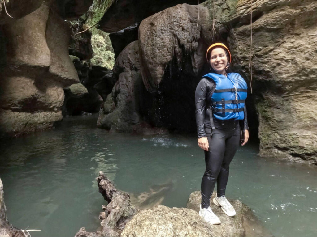 The author Vanessa Ramos smiling for a photo in Cueva Arenales