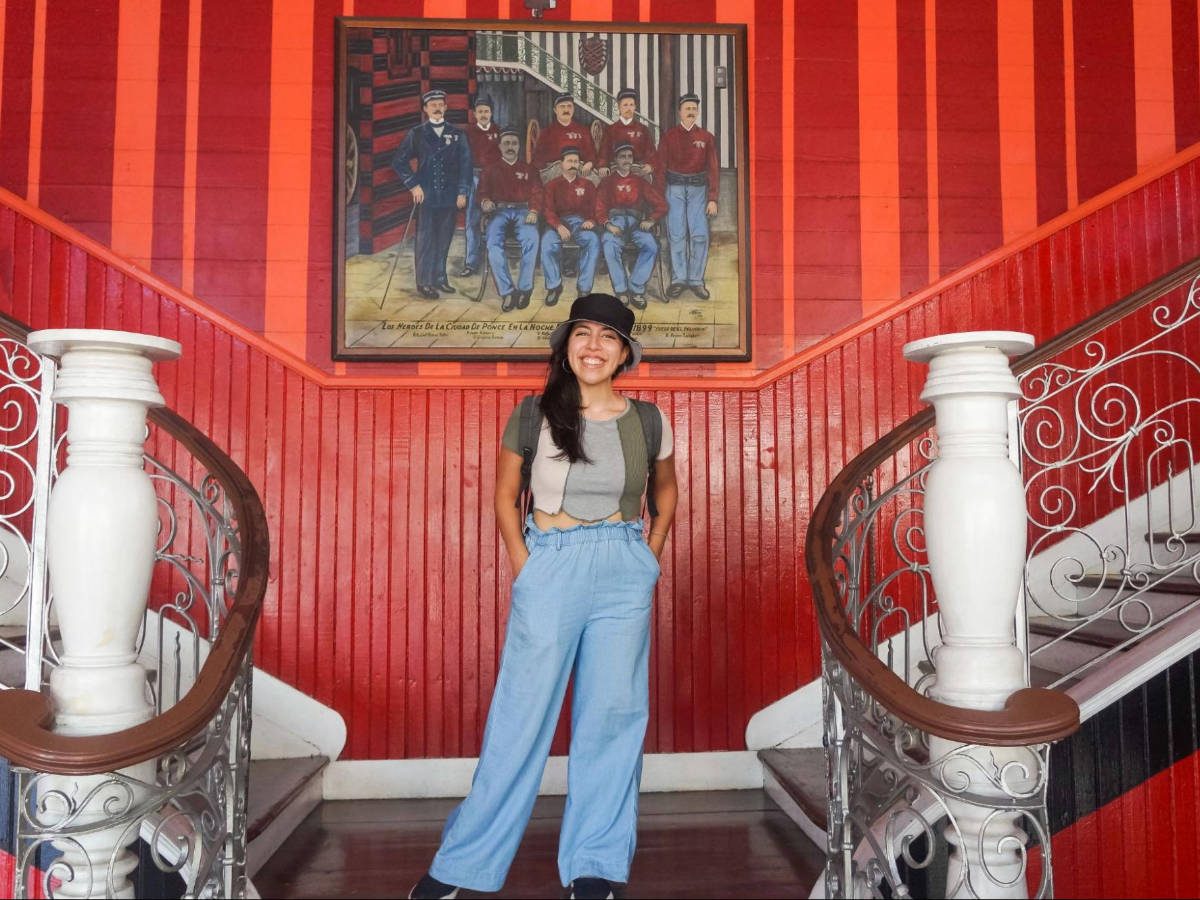 The author, Vanessa Ramos smiling for a photo inside the Parque de Bombas in Ponce