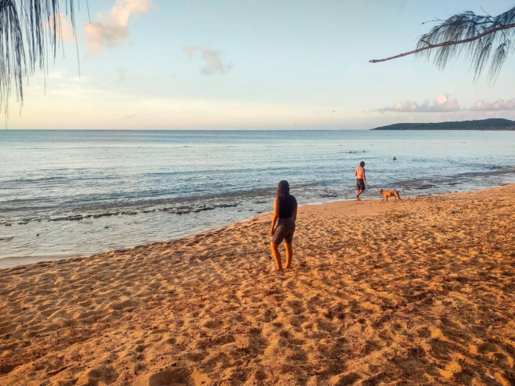 The author, Vanessa Ramos admiring the view in Seven Seas Beach