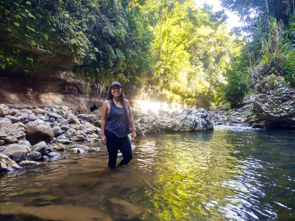 The author Vanessa Ramos, posing on the water at Tanama Canyon