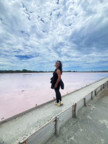 The author Vanessa Ramos smiling for a photo in Cabo Rojo Salt Flats