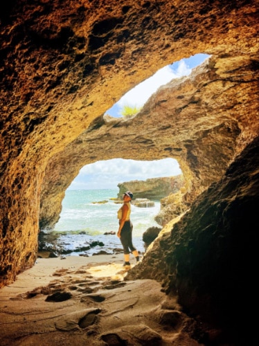 The author Vanessa Ramos, posing for a photo at the entrance of Cueva Jagüey