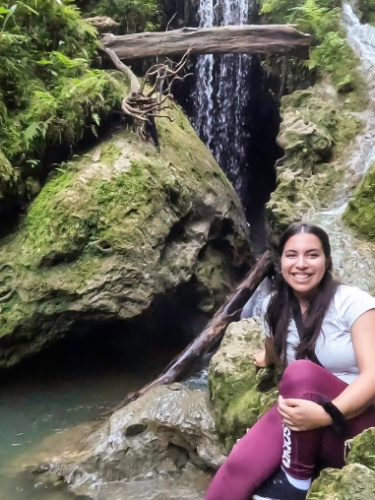 The author Vanessa Ramos smiling for a photo at the Cueva Larga