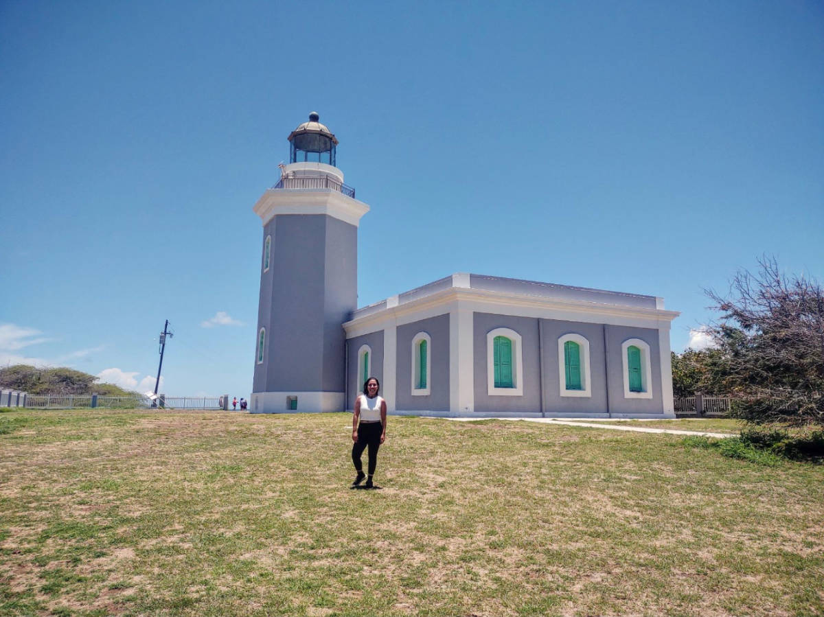 The author Vanessa Ramos in front of the Los Morrillos Lighthouse