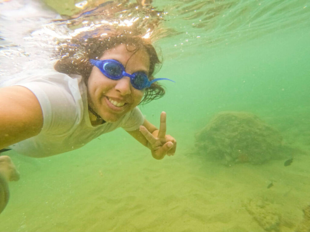 The author Vanessa Ramos taking a photo while snorkeling under the water in Playa Peña