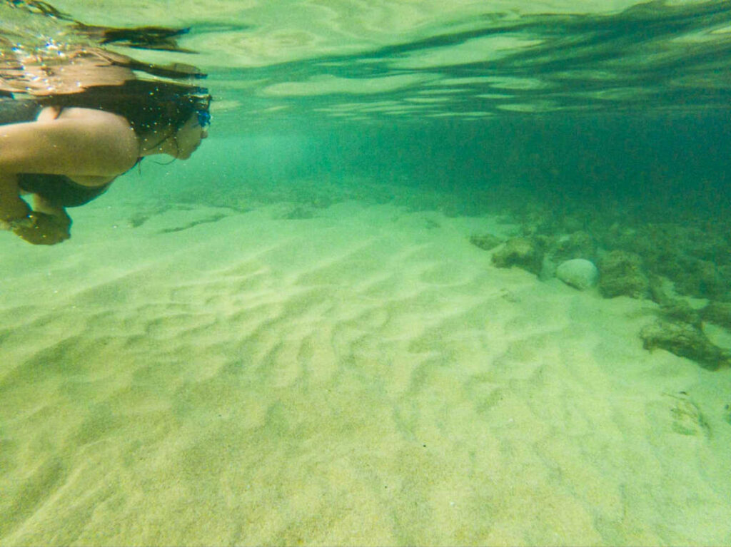 The author Vanessa Ramos swimming on the water of Mar Chiquita