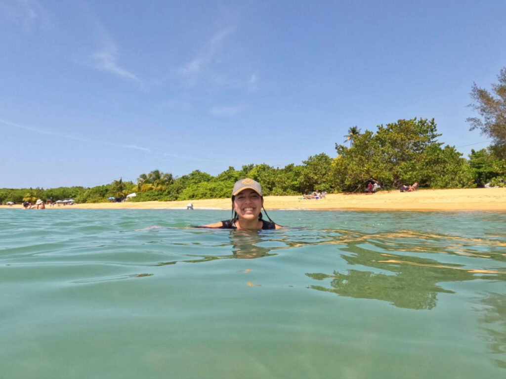 The author Vanessa Ramos swimming on the turquoise water of Playa Vacia Talega