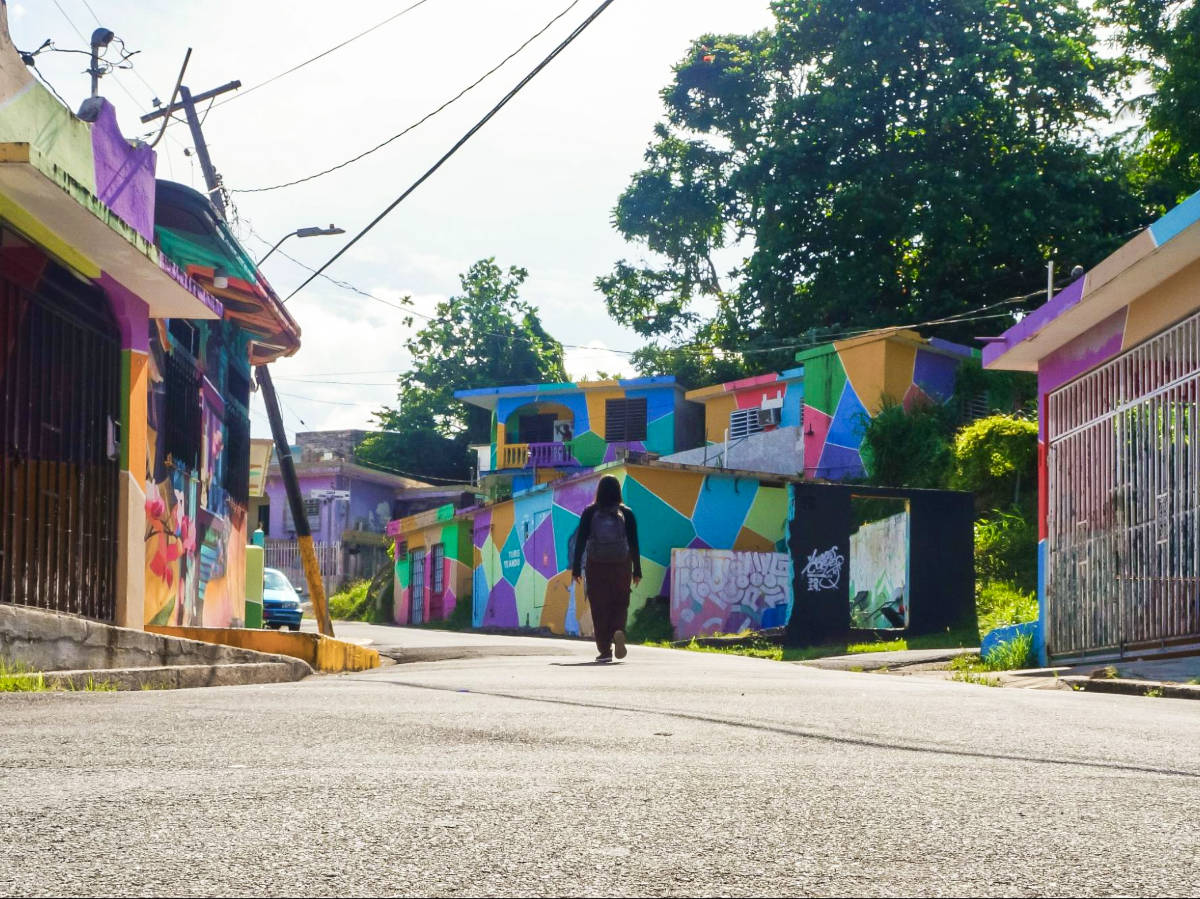 The author Vanessa Ramos walking along the colorful street at Yauco