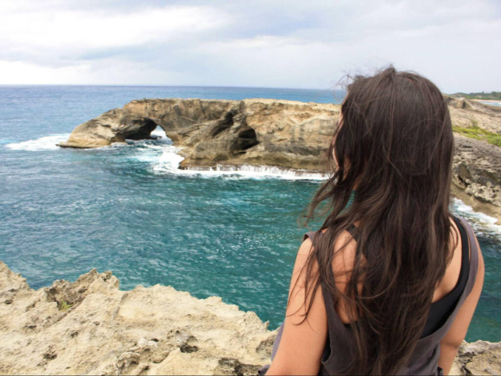 The author Vanessa Ramos, overlooking the beach views at Cueva del Indio
