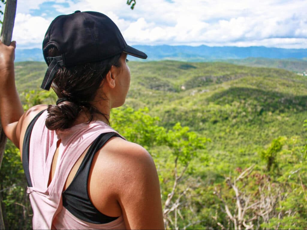 The author Vanessa Ramos, overlooking the scenic view from Guanica Dry Forest’s Tallest Viewpoint