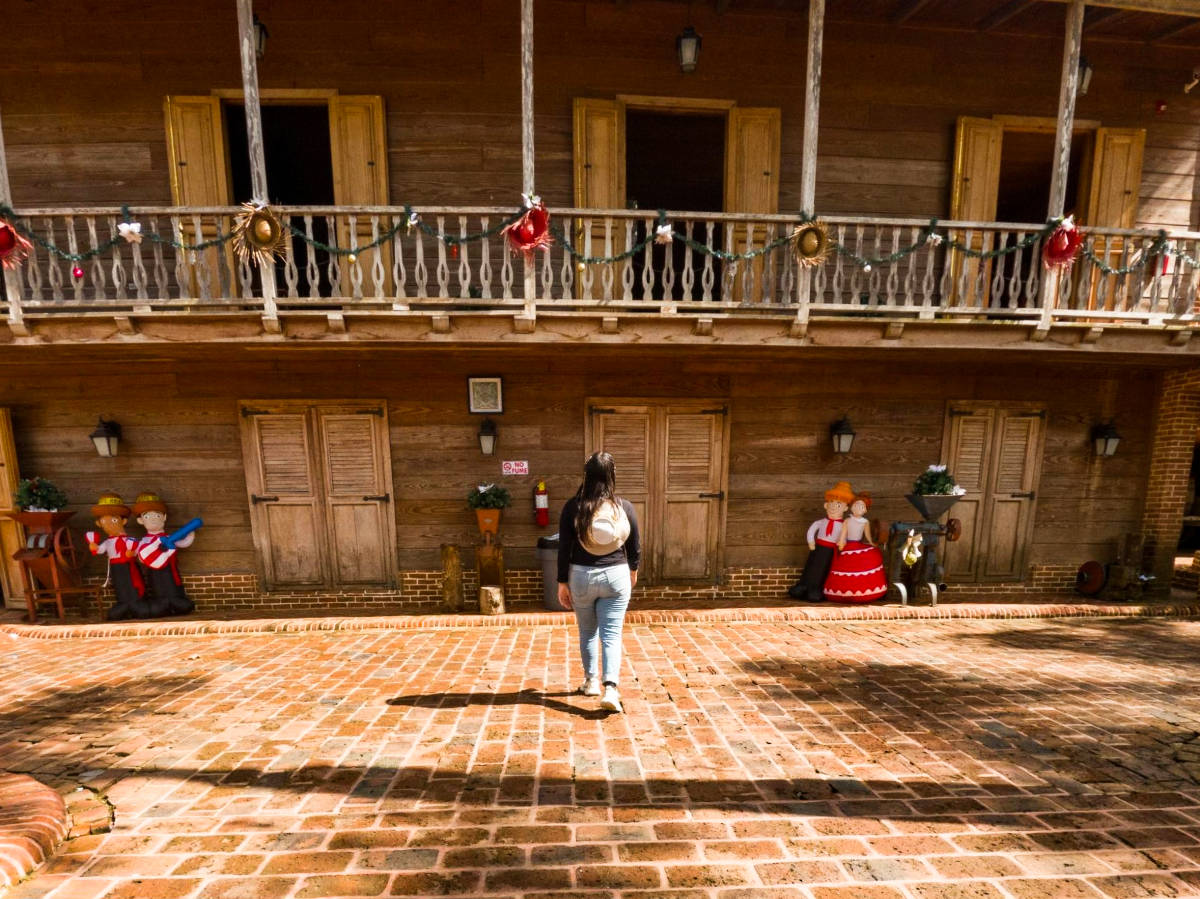 The author Vanessa looking up at the casona in Hacienda Lealtad