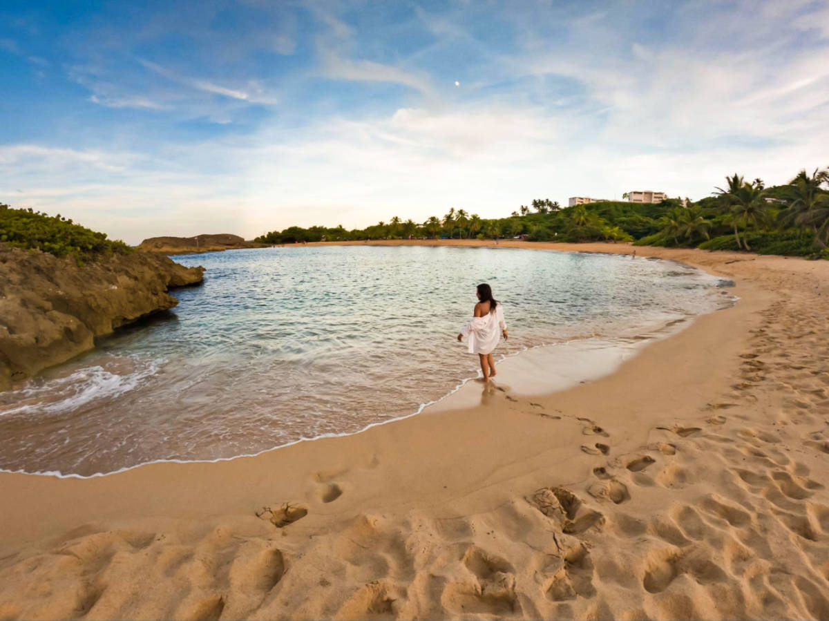 The author Vanessa Ramos enjoying the sandy beach at Mar Chiquita