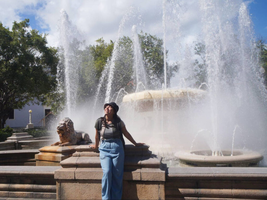 The author Vanessa Ramos enjoying at the fountain in Plaza Las Delicias