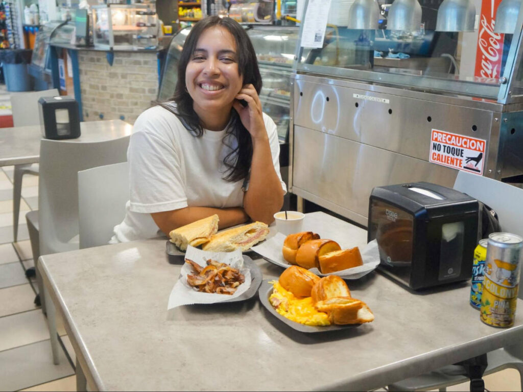 The author Vanessa Ramos with a variety of pastries at the local bakery