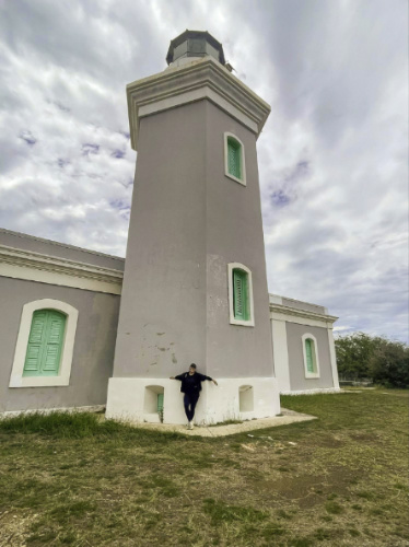 The author Vanessa Ramos in front of the Los Morrillos Lighthouse