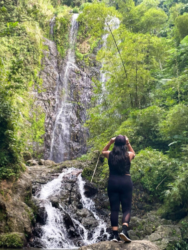 The author Vanessa Ramos, admiring the falls in Charco Prieto