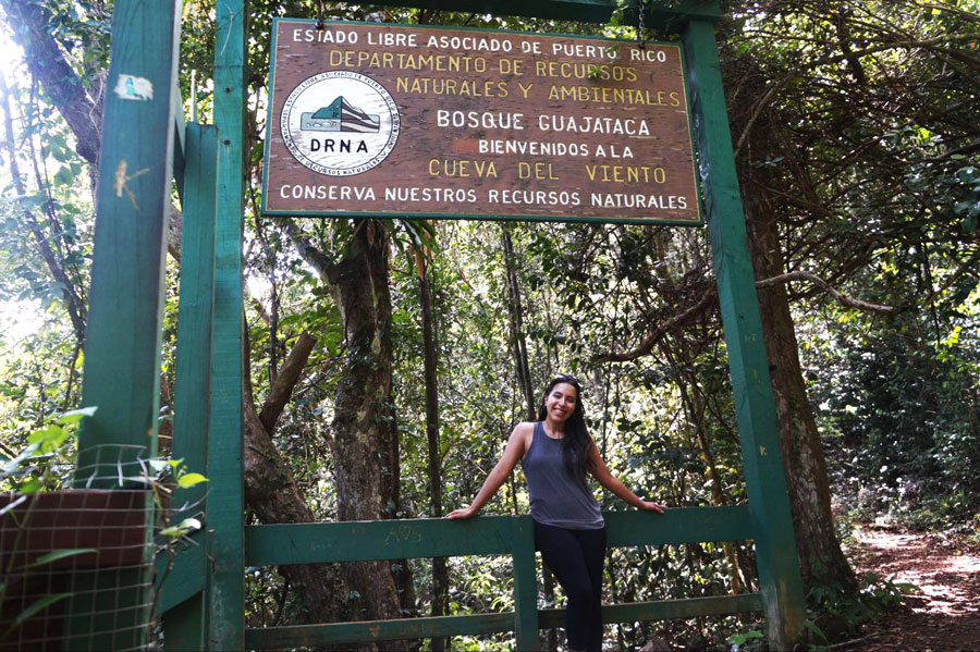 The author in front of the hiking trail sign