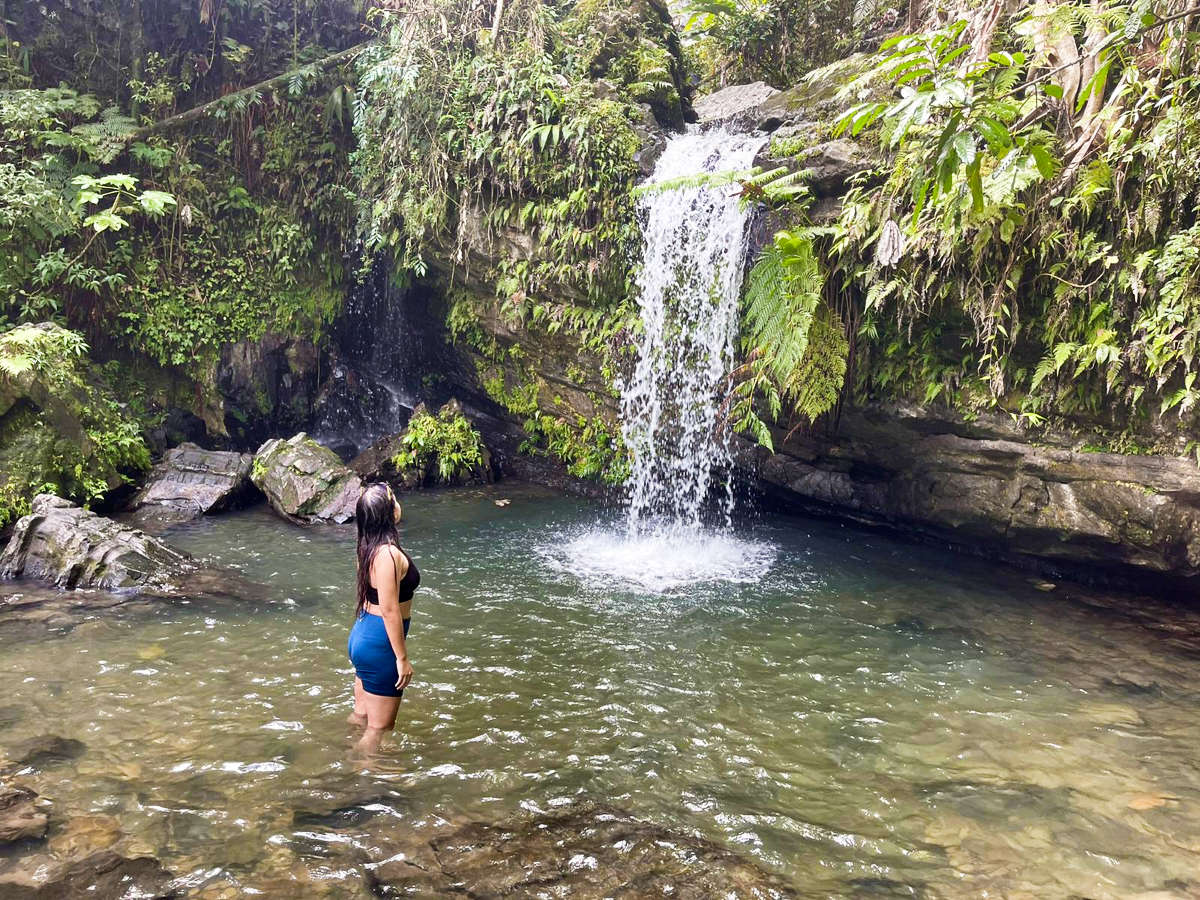 The author Vanessa Ramos, admiring the Juan Diego Falls from the water