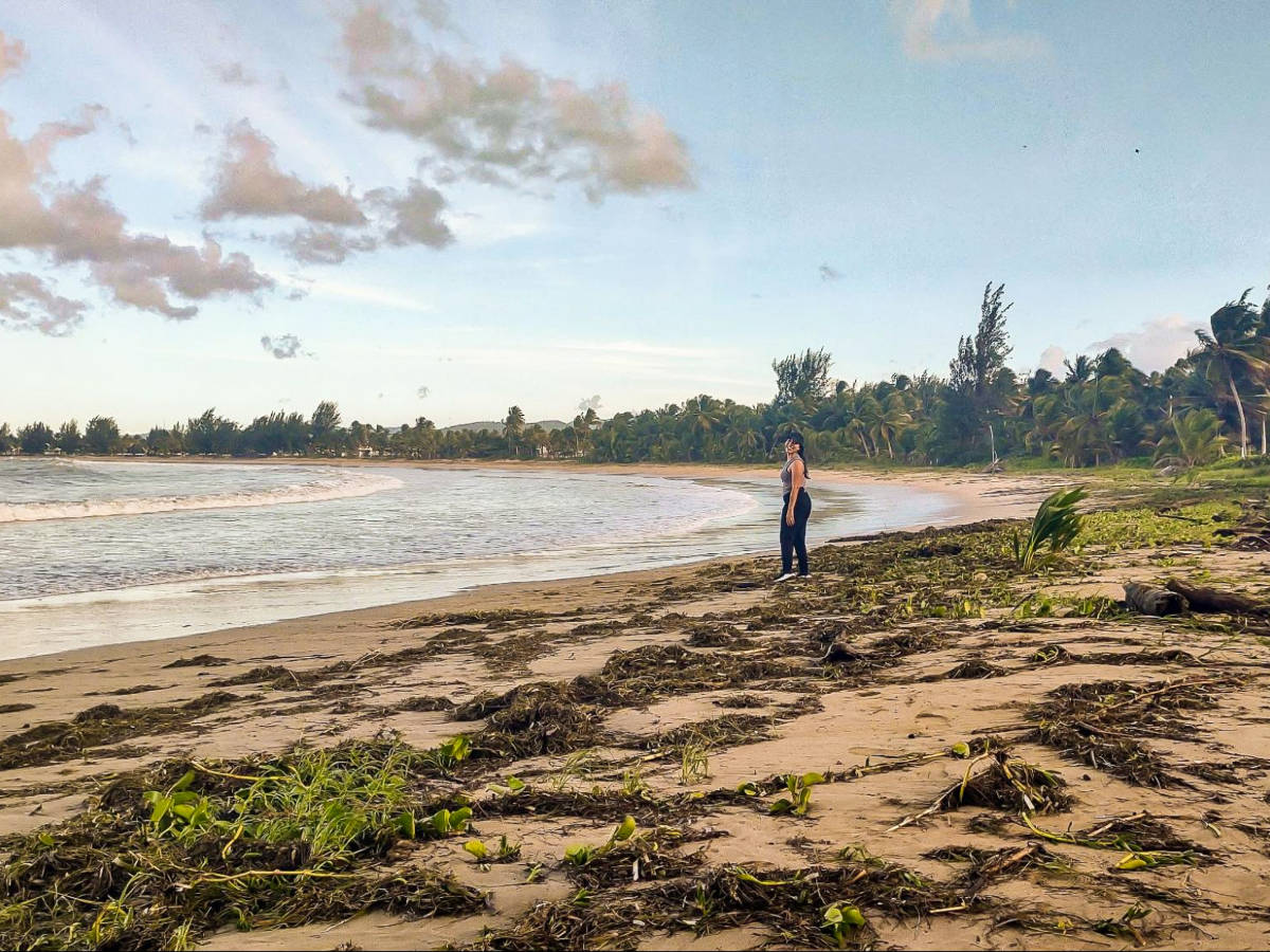 The author Vanessa Ramos, posing for a photo along the shoreline of Las Picuas Beach