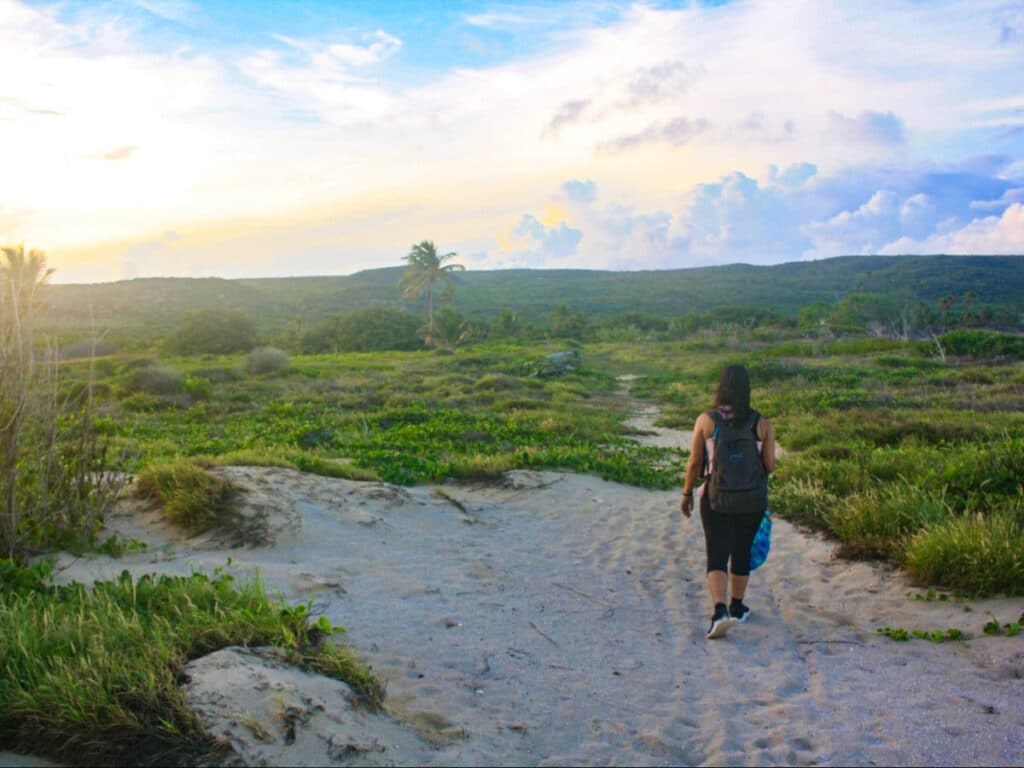 The author Vanessa Ramos, hiking in Punta Ballena Nature Reserve during sunrise