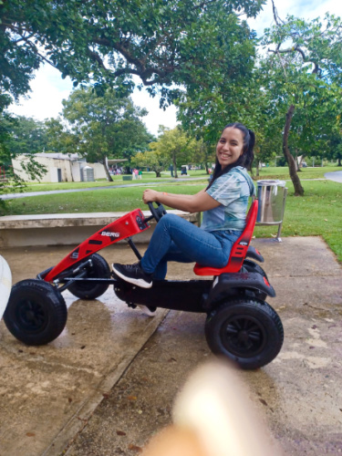 The author Vanessa Ramos riding a pedal kart in Parque Luis Muñoz Marín