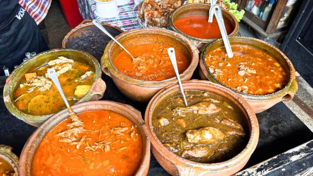 View of the variety of Guatemalan stews on the traditional pots at La Cuevita de Los Urquizú