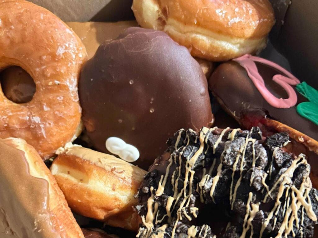 Closeup look of a variety of donuts from Voodoo Doughnut