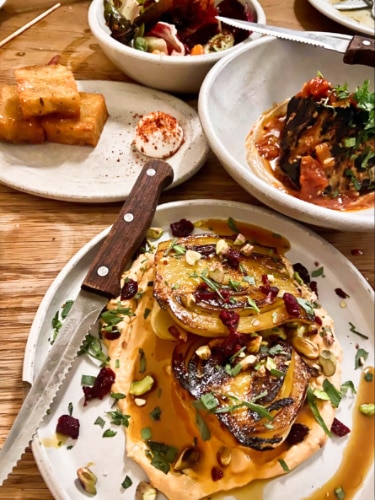 View of different vegetarian Middle Eastern food served in Bubala