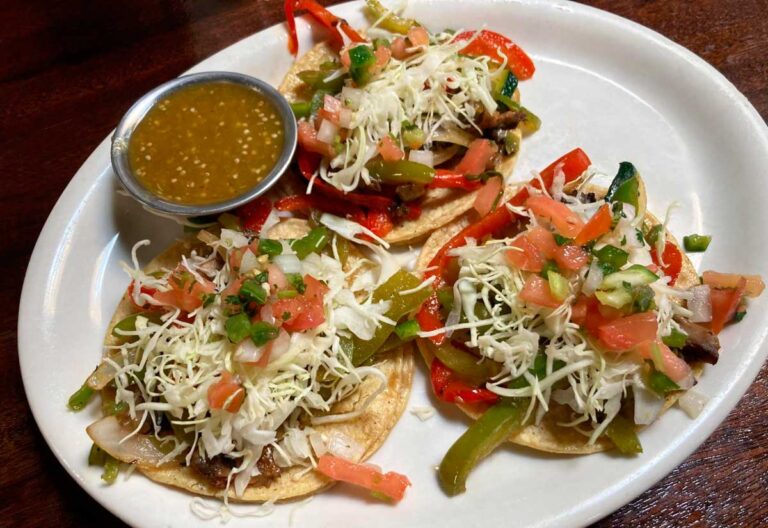 Veggie tacos with dip on a plate at Adelitas Cocina Y Cantina