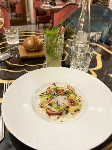 A colorful salad served in Pink Pearl