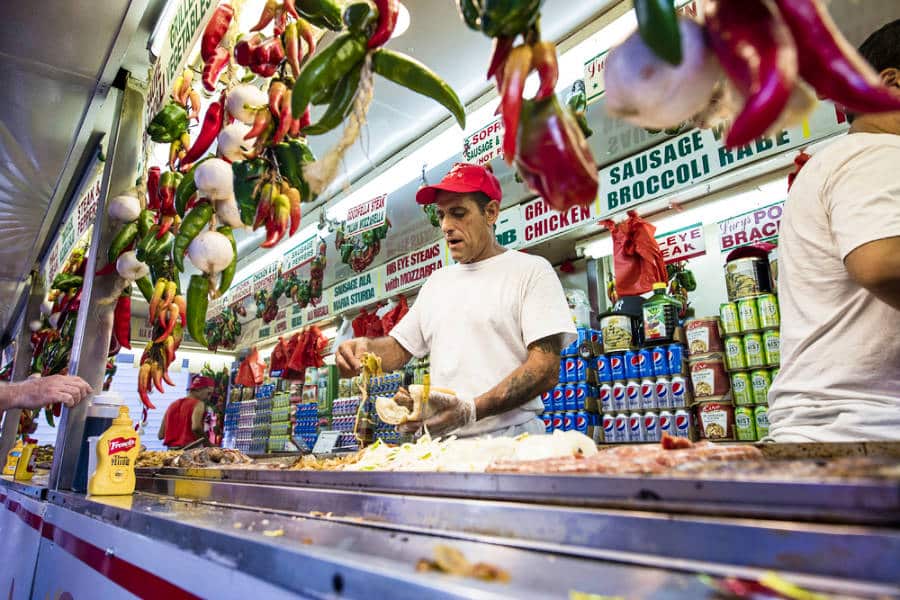 A vendor preparing Italian food in San Gennaro Feast