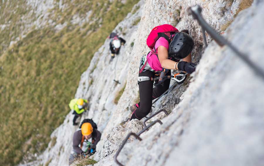 A group of climbers on Via Ferrata climbing route