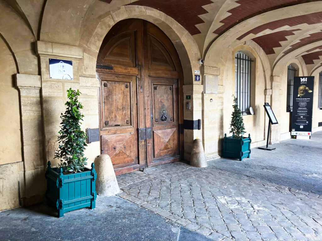 View of the classic wooden door of Victor Hugo's house