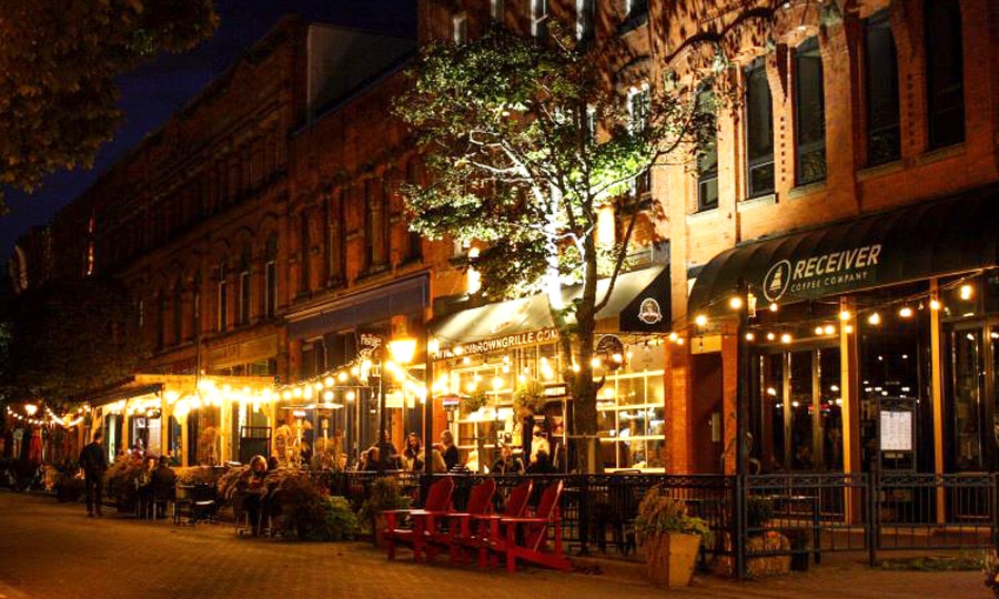 View of people along the Victoria Row at night time