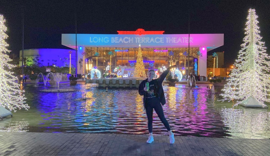 The author in front of the Long Beach Theater around Christmas time