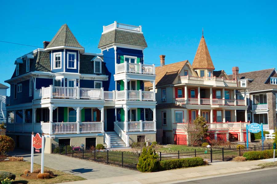 View of Victorian houses under the clear blue sky in Beach Avenue