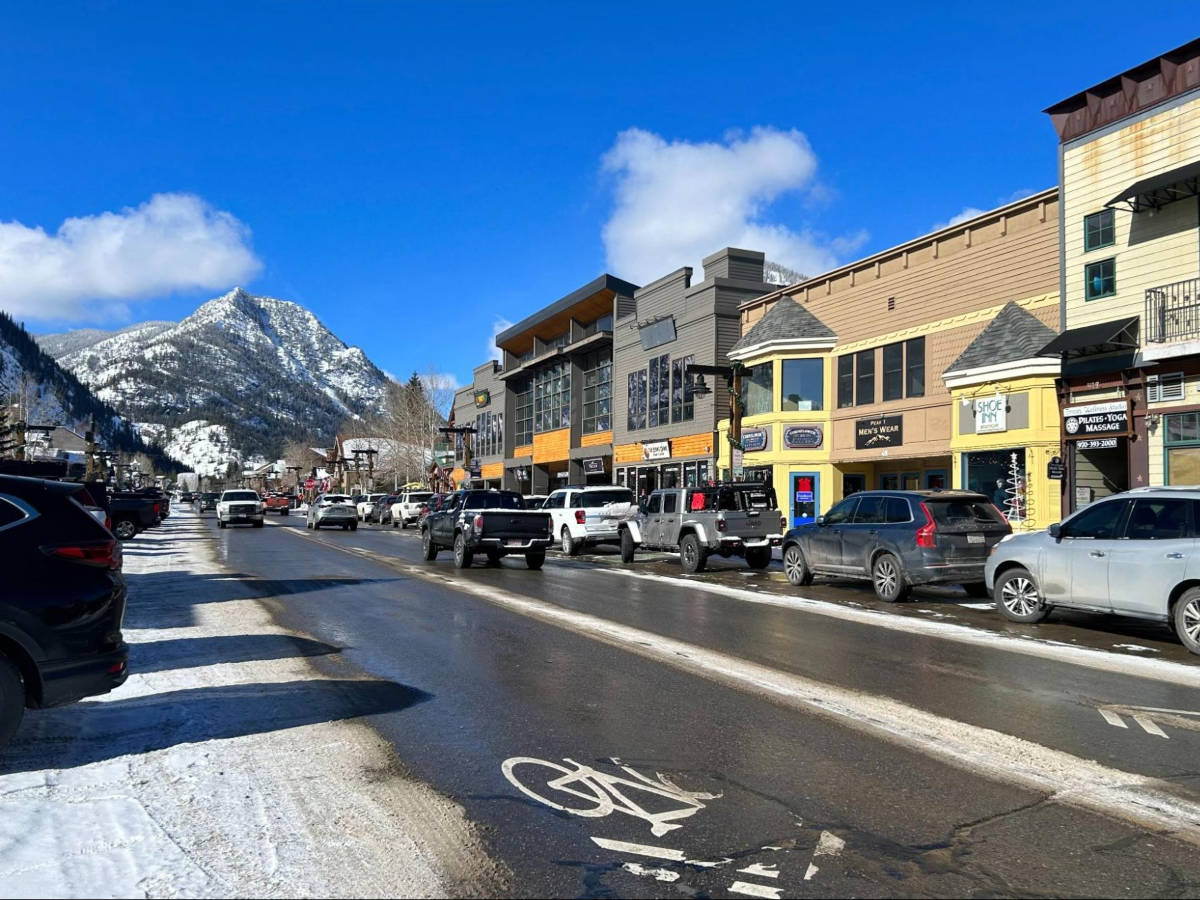 View of the shops and restaurants with mountain views from Downtown Frisco