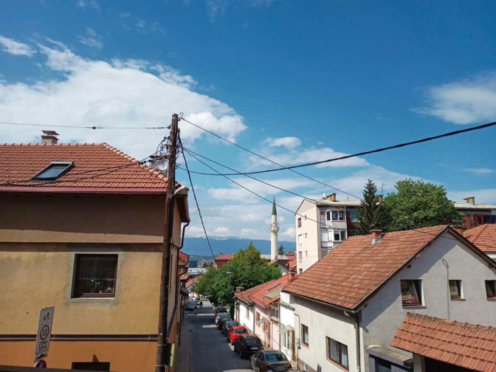 View of houses and the street from a Hostel Kucha room