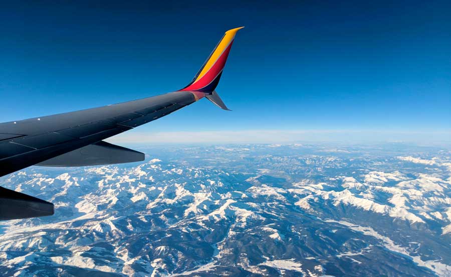 View of the plane's wing while on an airplane