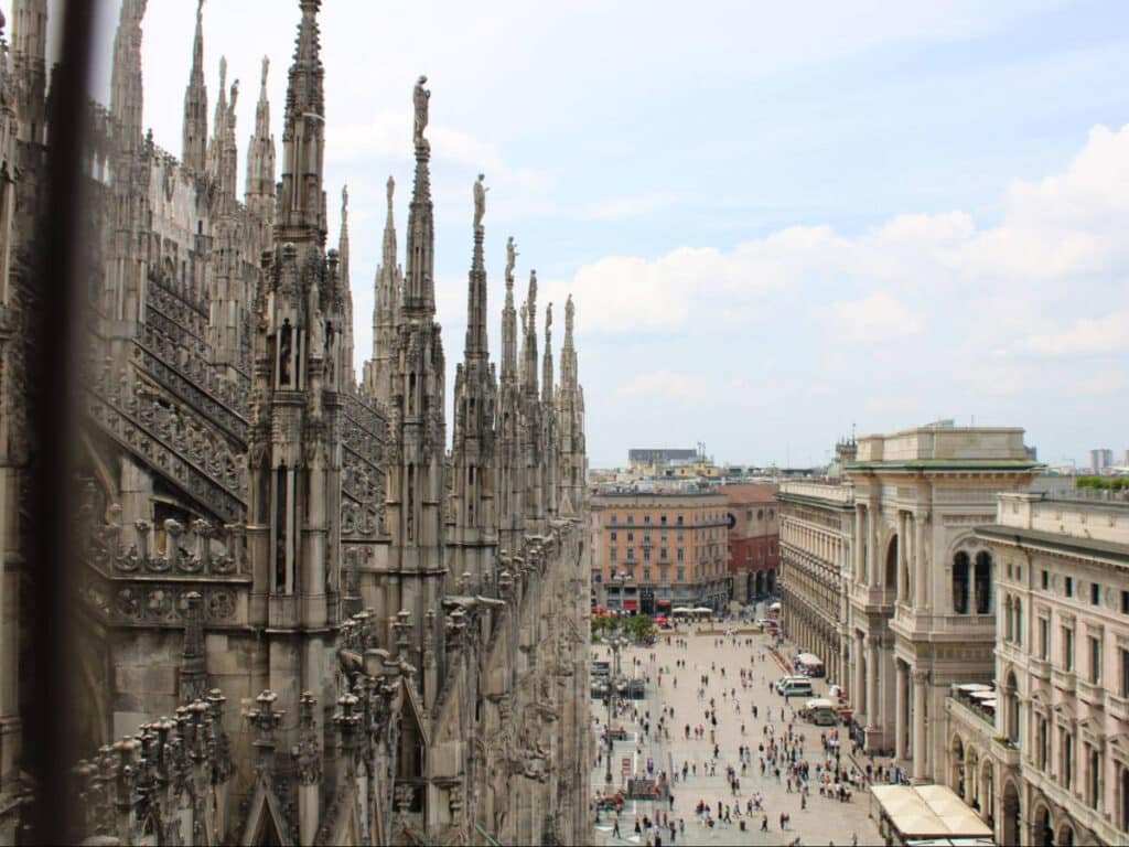 Closeup view of the intricate architecture of Duomo di Milano and the overlooking view of Milan